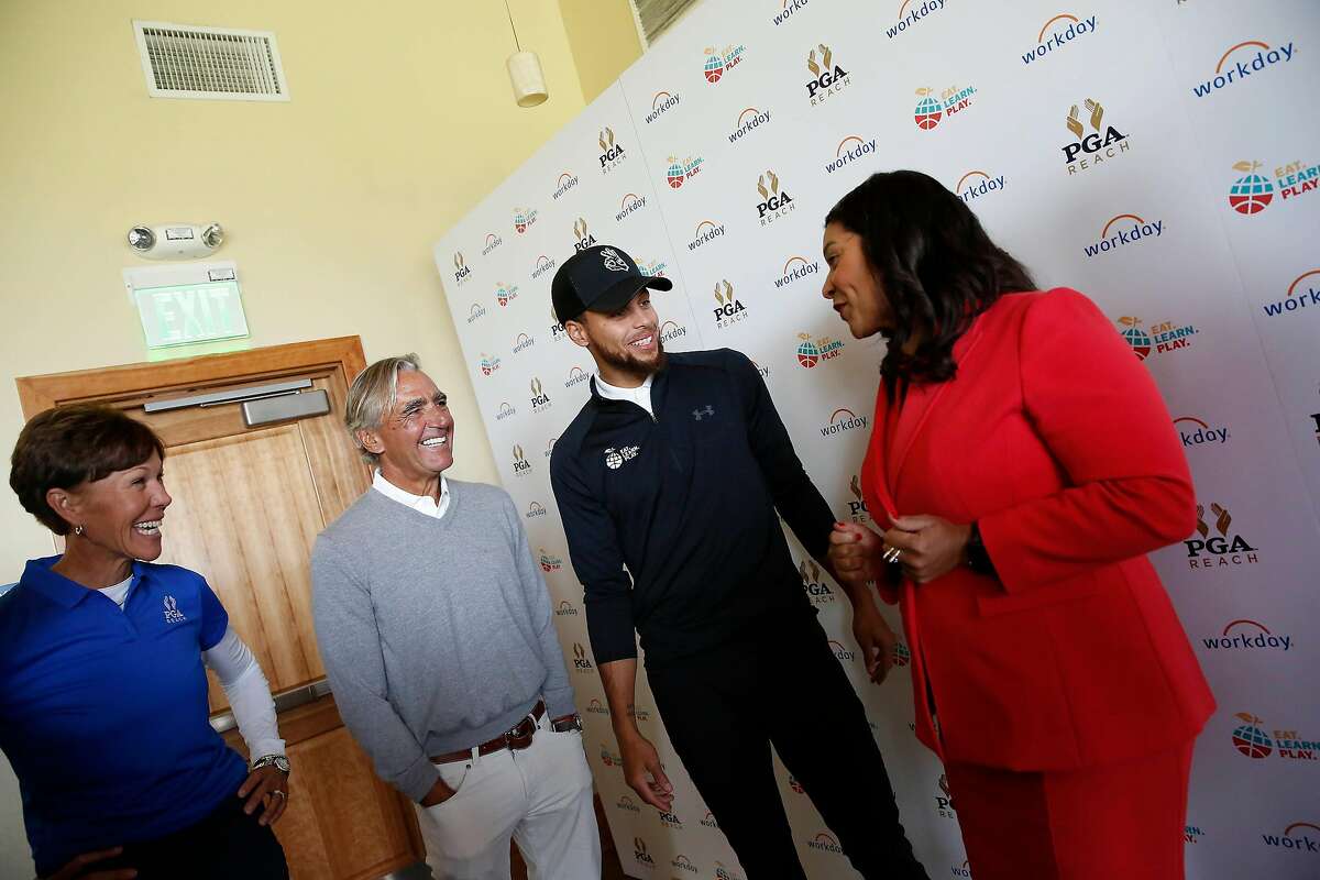 Stephen Curry (second from right) chats with San Francisco Mayor London Breed (right), PGA of America CEO Seth Waugh (second from left) and PGA President Suzy Whaley (left) before the Steph Curry Charity Classic at Harding Park on Sept. 16, 2019.