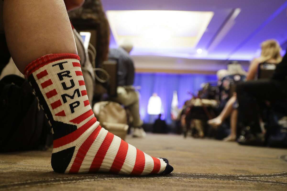 FILE - In this Saturday, Sept. 7, 2019, file photo, a Trump supporter listens as Brad Parscale, campaign manager for Trump's 2020 reelection campaign, speaks during the California GOP fall convention in Indian Wells, Calif. State Republicans have approved a rule change intended to ensure the party can send delegates to the GOP's national convention next summer, even if President Trump is kept off the state's 2020 primary ballot. The measure is a response to a law signed by Democratic Gov. Newsom in July that requires presidential candidates to release their tax returns, a move clearly aimed at the Republican president. (AP Photo/Chris Carlson, File)