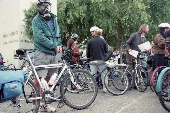 May 27, 1994: A Critical Mass participant wears a gas mask during  one of the earliest bicycle rides on the city's streets.