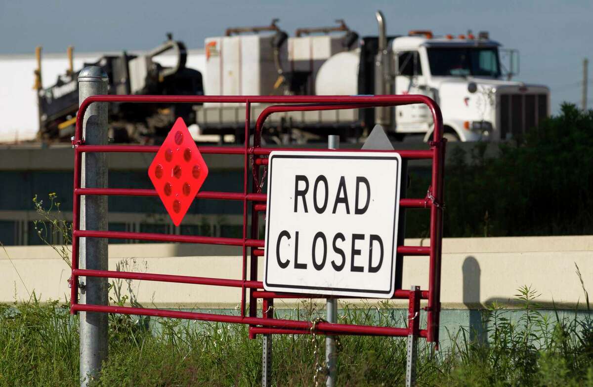 One of Conroe’s new road closure gates is seen along the I-45 North feeder road near Texas 105.