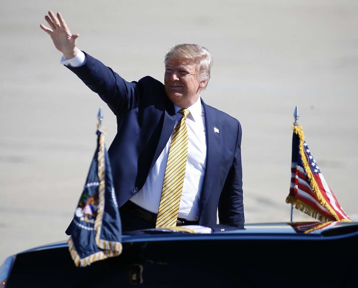 President Trump waves to supporters after arriving aboard Air Force One at Moffett Federal Airfield in Mountain View, Calif. to attend a Republican Party fundraiser at an undisclosed location on Tuesday, Sept. 17, 2019.