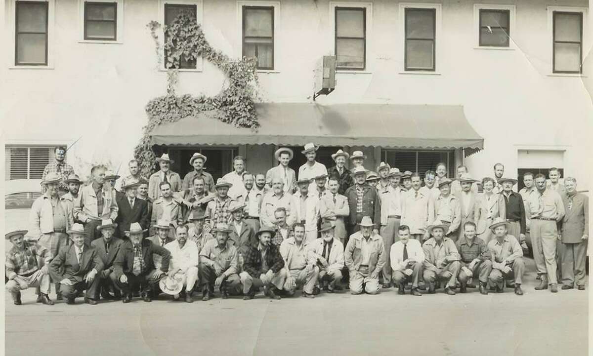 The Conroe Lions Club in the 1950s in front of the Burch Hotel.