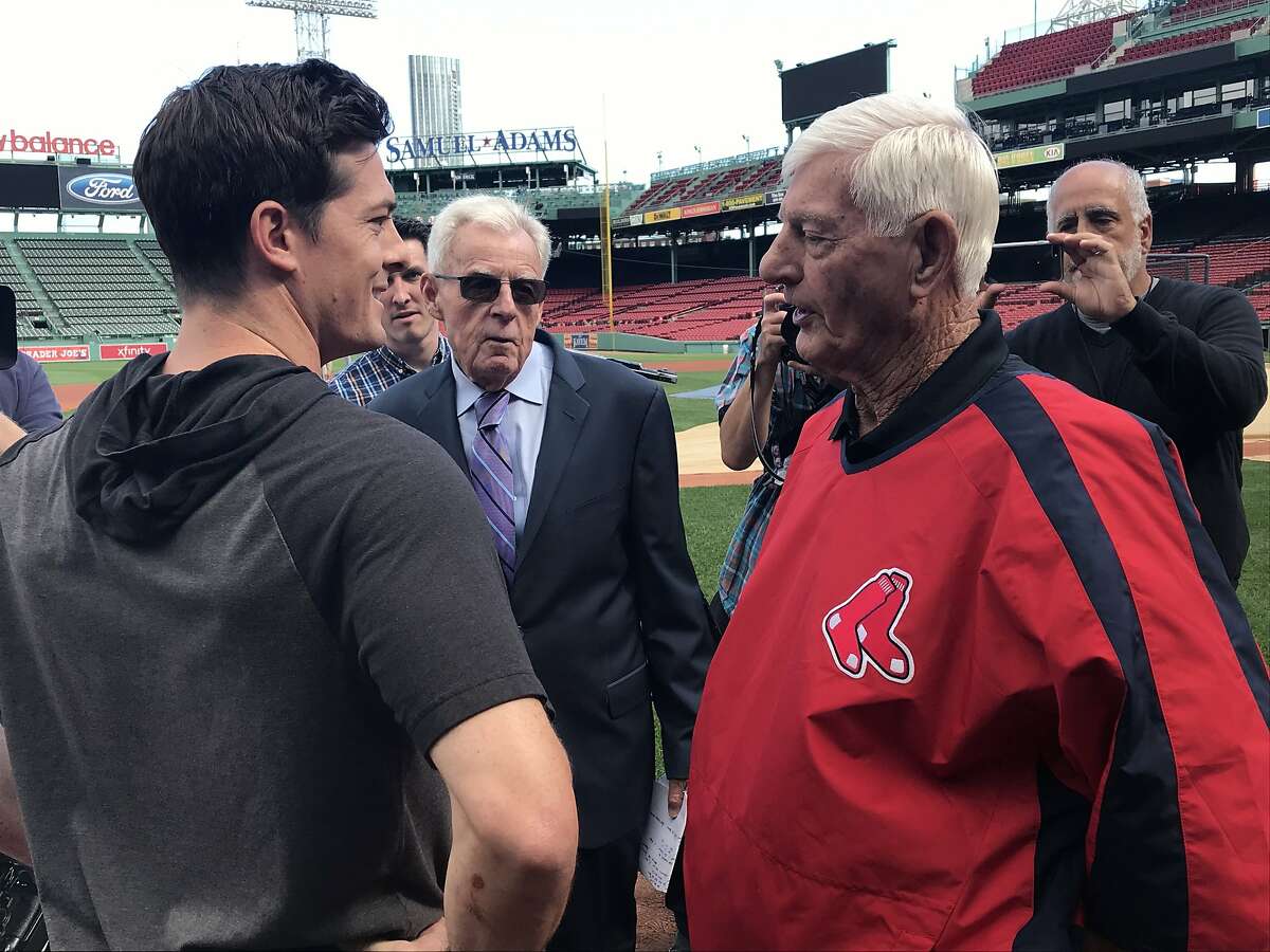 Red Sox player' Carl Yastrzemski throws a first pitch to his 29-year-old  Giants rookie grandson