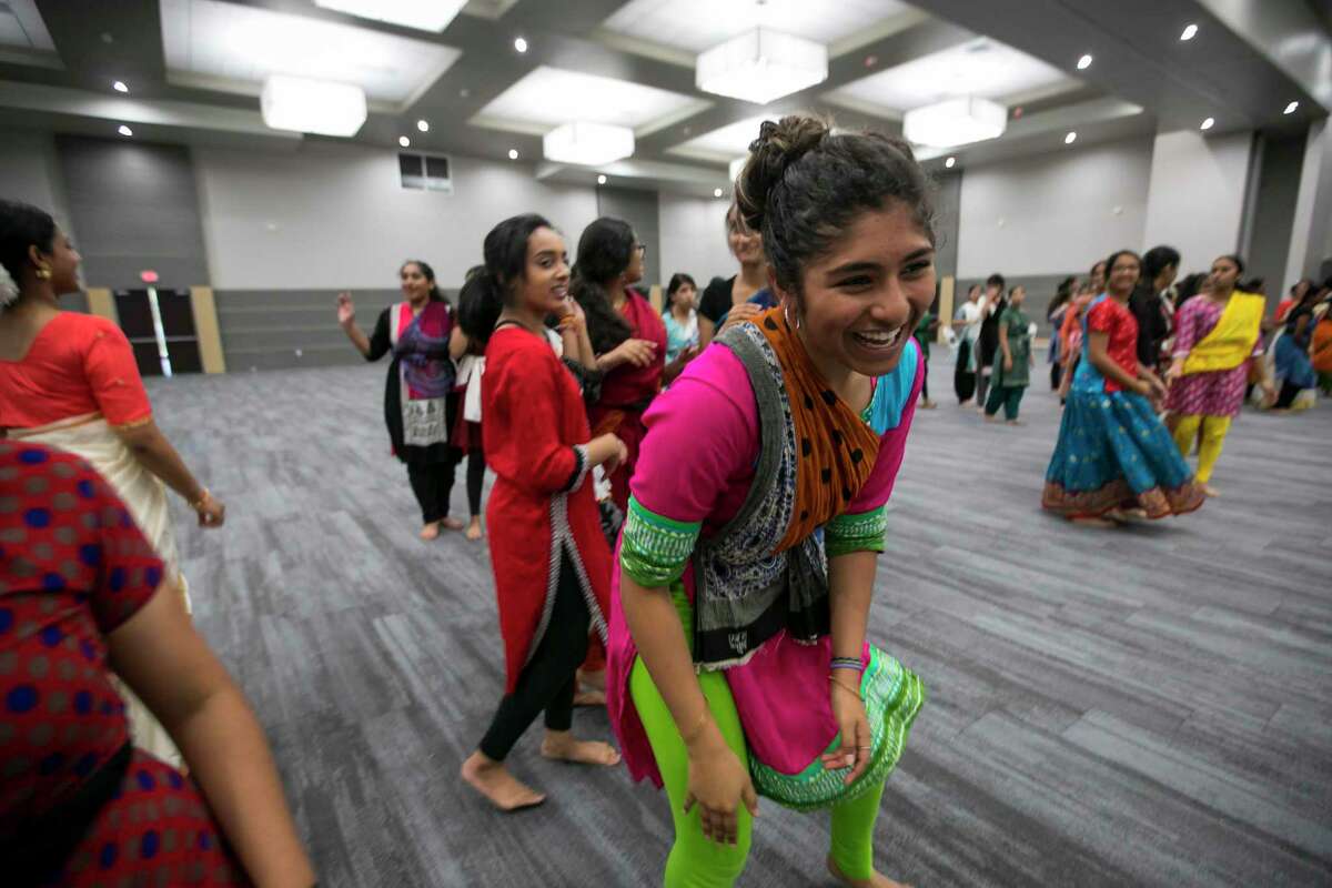 Bhavana Gollapudi laughs during dance practice at Gujarati Samaj on Sunday, Sept. 15, 2019, in Houston. Several forms of classical Indian dance groups will join other styles of dance as part of a bigger performance entitled “Woven” by artistic director Heena Patel.