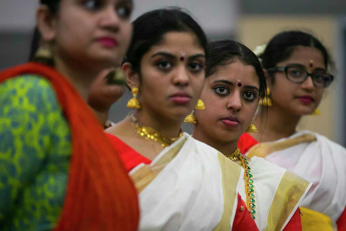 Dancers line up to listen to instruction during dance practice at Gujarati Samaj on Sunday, Sept. 15, 2019, in Houston. Several forms of classical Indian dance groups will join other styles of dance as part of a bigger performance entitled “Woven” by artistic director Heena Patel.