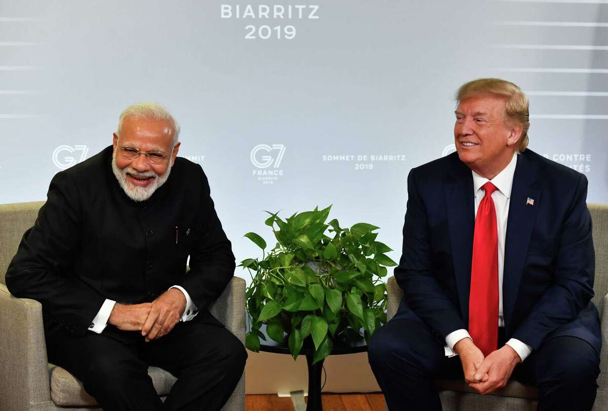 In this file photo taken on August 25, 2019 Indian Prime Minister Narendra Modi (L) and US President Donald Trump speak during a bilateral meeting in Biarritz, south-west France on the third day of the annual G7 Summit. Trump will join Modi at a massive gathering of Indian-Americans in Houston on September 15, 2019.