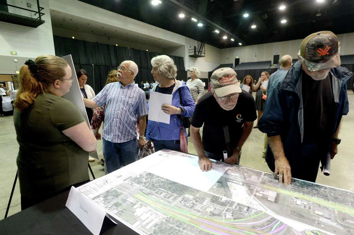 Citizens talk with representatives as they pour over rows of schematics showing the proposed changes in TxDOT's $500 million project affecting numerous spots on Interstate 10 and US Highway 69 within the Beaumont district. Photo taken Tuesday, September 17, 2019 Kim Brent/The Enterprise