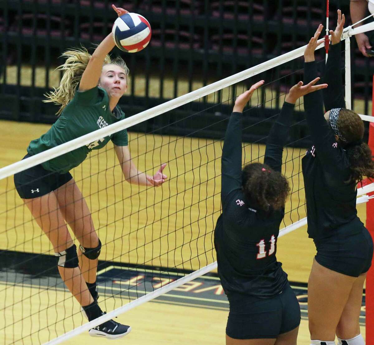 Alexis Durish hits for the Rattlers as Reagan beats Churchill 3-0 in volleyball at Littleton Gym on Nyah Anderson hits for the Rattlers Sept. 17, 2019.