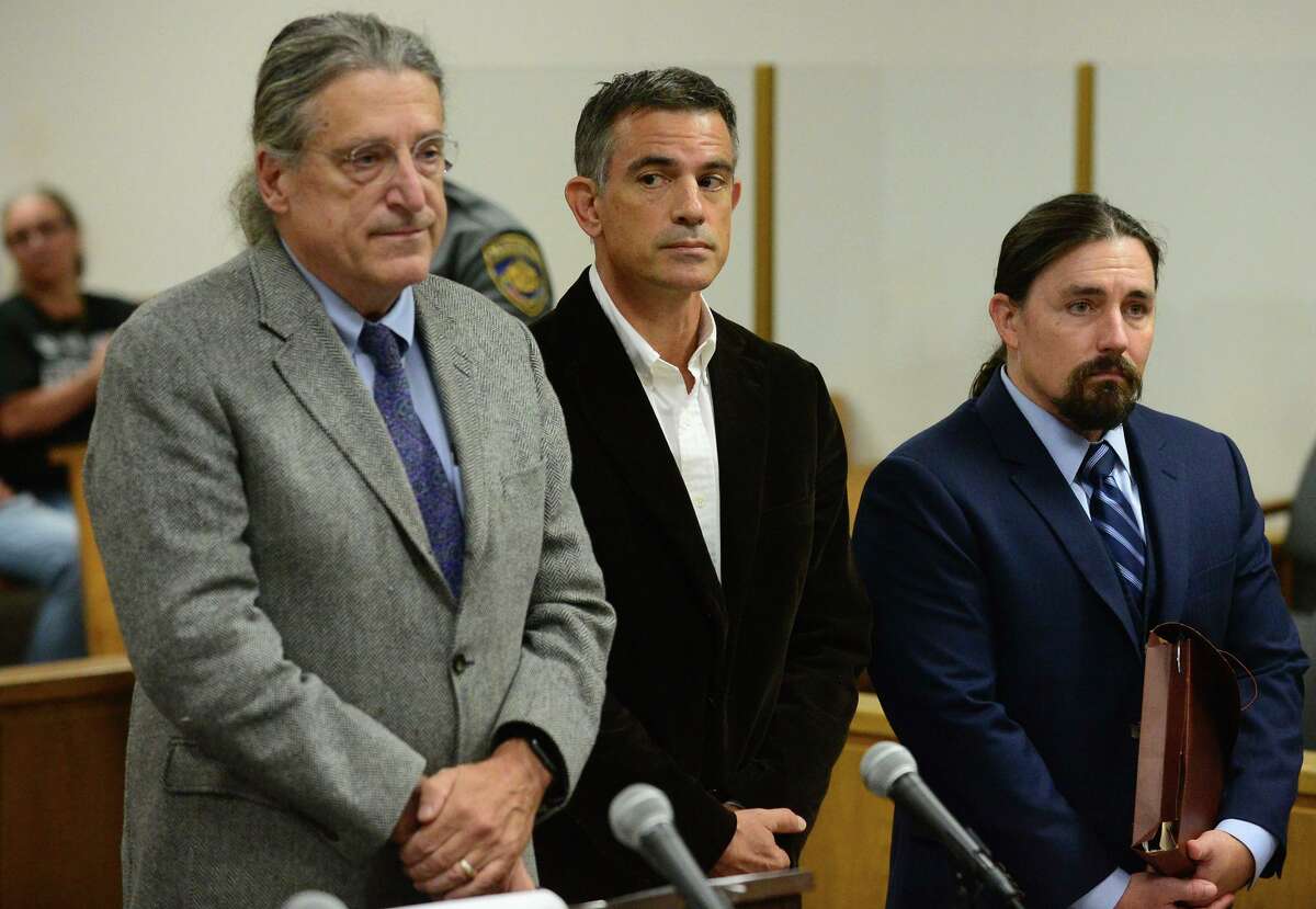 Fotis Dulos, center, appears with his attorneys Norm Pattis, left, and Kevin Smith, right, for arraignment on a new tampering with evidence charge Thursday, Sept. 12, 2019, at state Superior Court in Norwalk, Conn.