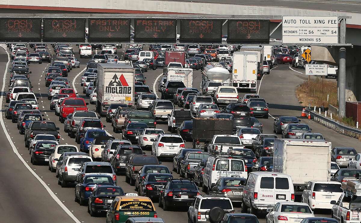 OAKLAND, CA - JULY 02: Commuter traffic backs up at the toll plaza to the San Francisco-Oakland Bay Bridge on July 2, 2013 in Oakland, California. For a second day, hundreds of thousands of San Francisco Bay Area commuters are scrambling to find ways to work after two of San Francisco Bay Area Rapid Transit's (BART) largest unions went on strike early yesterday morning following contract negotiations with management falling apart the day before. Train operators, mechanics, station agents and maintenance workers are seeking a five percent wage increase and are fighting management who want to have workers to begin contributing to their pensions, pay more for health insurance and reduce overtime expenses. (Photo by Justin Sullivan/Getty Images)