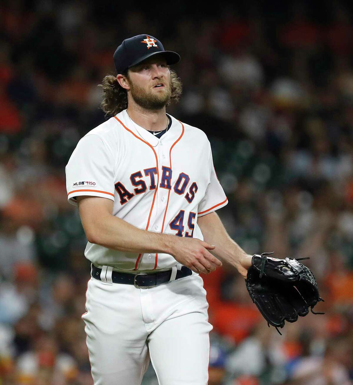 Houston Astros starting pitcher Gerrit Cole (45) reacts after striking out Texas Rangers Ronald Guzman in the second inning of an MLB baseball game at Minute Maid Park, Wednesday, Sept. 18, 2019, in Houston.