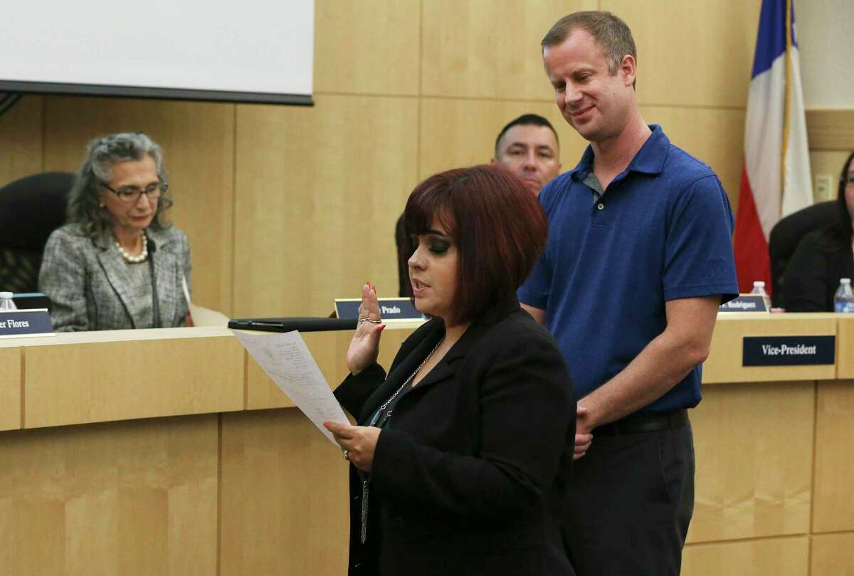 Stacey Alderete (front) and Kevin Rasco (back) take the oath of trustees as they were voted in as trustees during the South San school board meeting on Wednesday, Sept. 18, 2019. Alderete and Rasco replaced two of the three trustees who abruptly resigned recently.