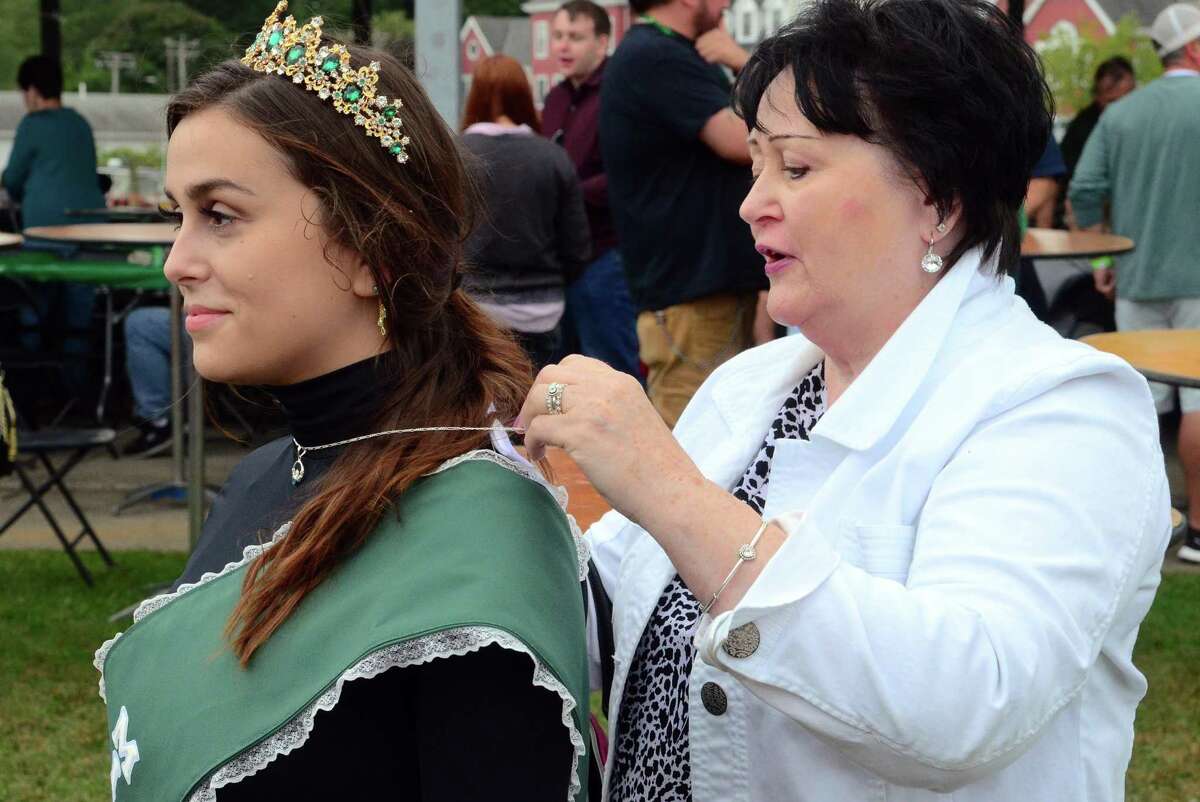 Marie Zawadski, of Milford, puts a necklace on her granddaughter Caitlyn Ann Dolan Zawadski, who is Miss Emerald Isle 2019 during the annual Milford Irish Festival in Milford, Conn., on Friday Sept. 13, and Saturday, Sept. 14.