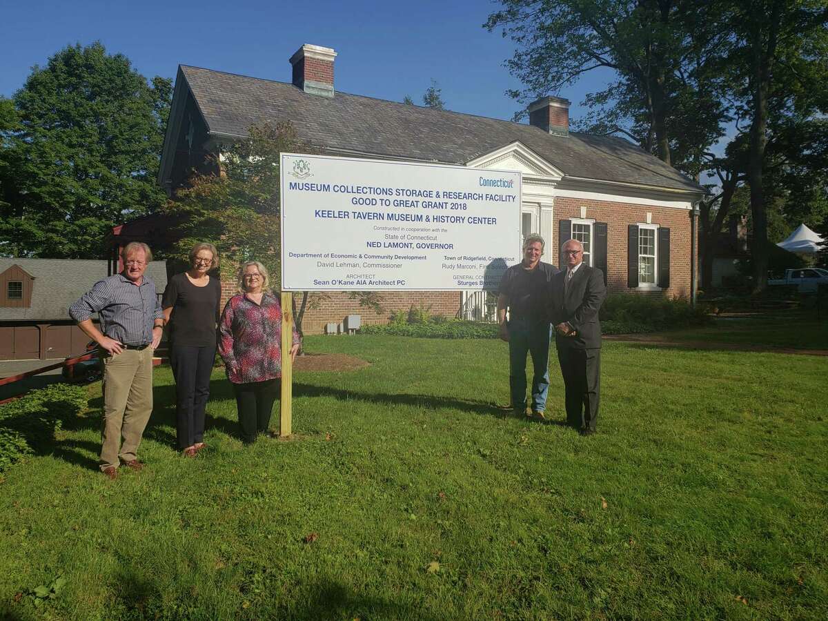 From left to right: Architect Sean O’Kane of Sean O’Kane AIA Architect PC; Keeler Tavern Museum & History Center Executive Director Hildegard Grob; KTM&HC Board President Rhonda Hill; Don Sturges of Sturges Brothers, Inc.; and First Selectman Rudy Marconi stand in front of the recently installed sign indicating that new construction on the site is partially funded by a 2018 Department of Economic and Community Development (DECD) Good to Great grant. The grant is substantially funding the creation of a state-of-the-art museum collections storage and research facility in the lower level of KTM&HC’s new Visitor Center located at 152 Main Street in Ridgefield.