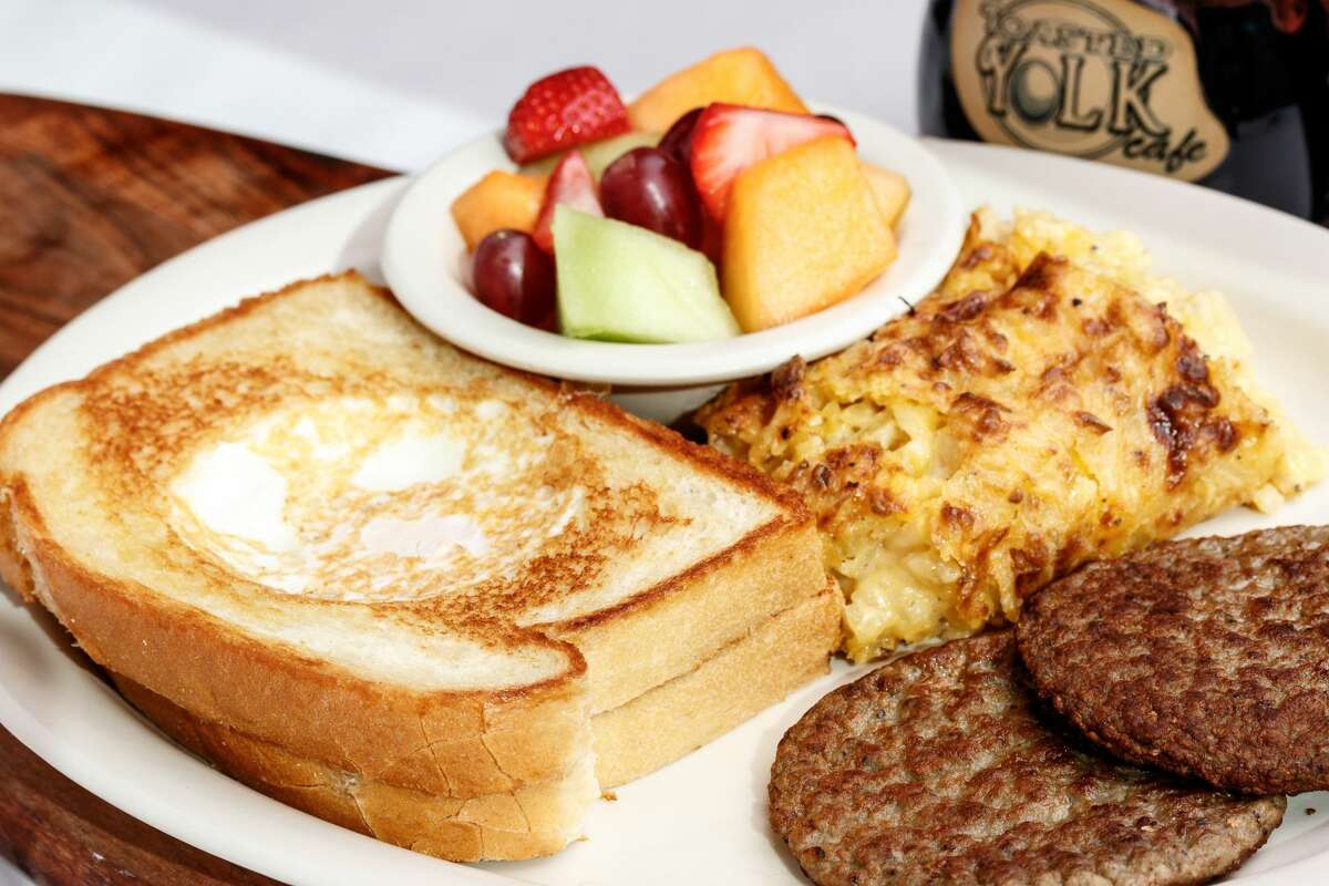 The Toasted Yolk, with two slices of sourdough bread grilled with an egg in the middle of each, is the breakfast and lunch restaurant's signature dish.