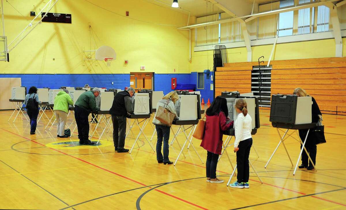 Voters at the polling place at Madison Middle School in Trumbull, Conn. on Tuesday Nov. 7, 2017.