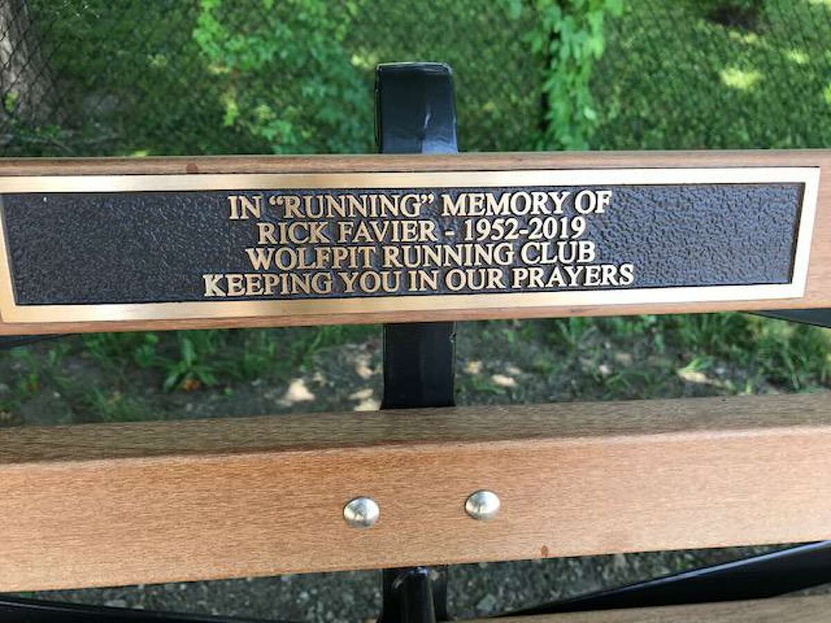 The inscription on the bench outside the Ridgefield Boys and Girls Club that honors Rick Favier.