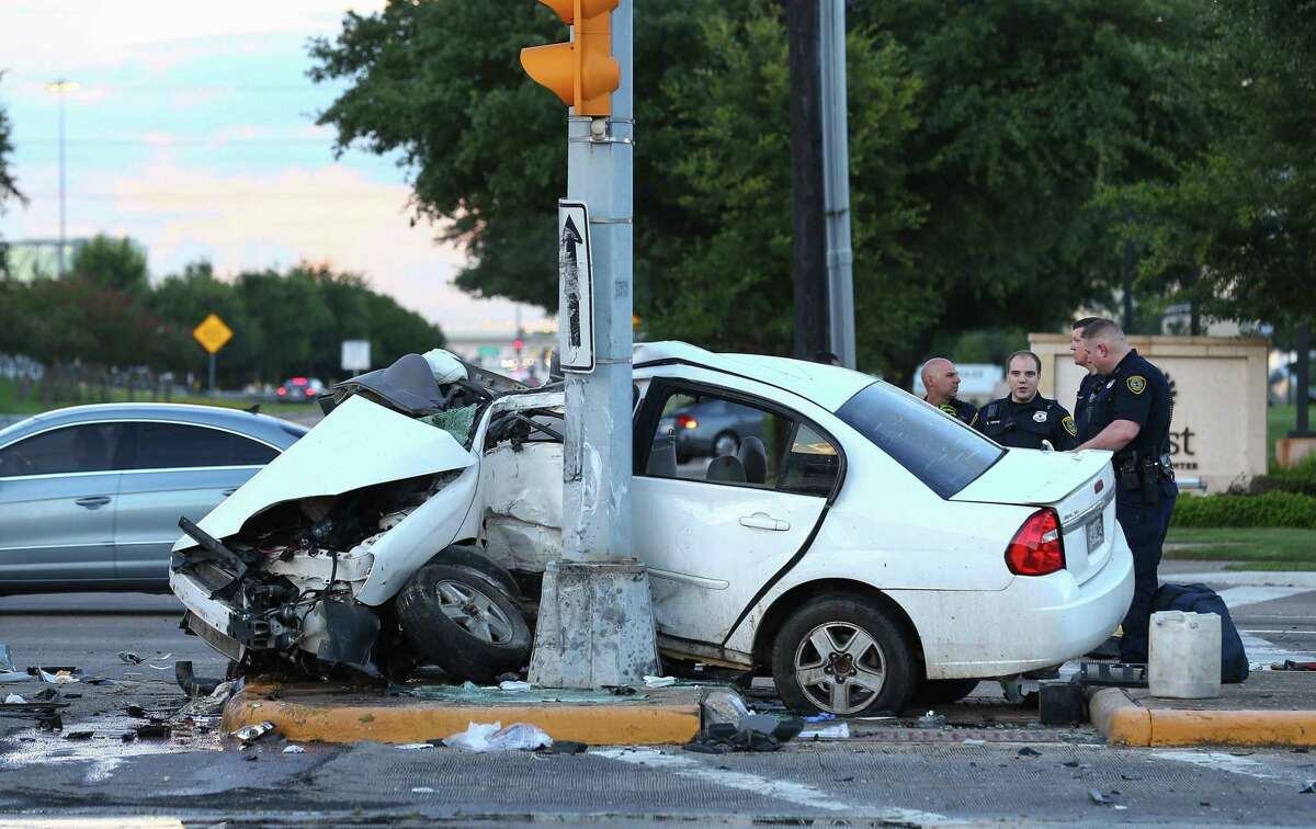 In Houston, home to some of the nation’s deadliest roads, there’s a high chance you or someone you know will get into a crash. Houston police officers respond to a two-vehicle accident at the intersection of West San Houston Parkway South and Richmond Avenue Tuesday, July 18, 2017, in Houston. ( Godofredo A. Vasquez / Houston Chronicle )