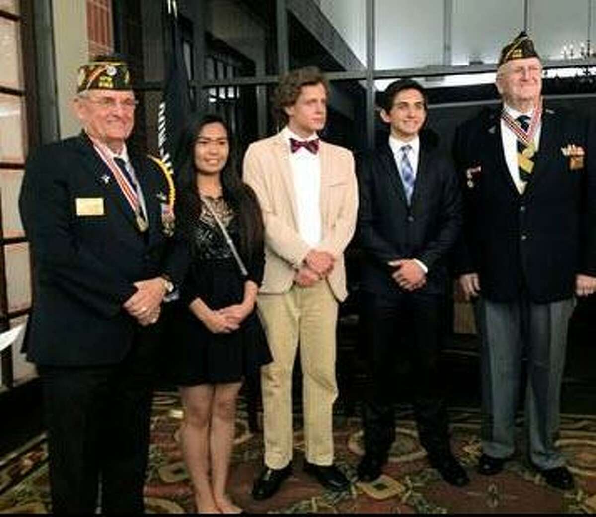 The Katy Veterans of Foreign Wars 9182 recognized The Voice of Democracy winners in the spring. They are: First Place James Belin Jr. of Tompkins High School, $500 award; Second Place Madison Muldune of Seven Lakes High School, $300 award; Third Place Rowan Lobdell of Tompkins High School, $200 award. This year's theme for the audio-essay program was “Why My Vote Matters.” From left are: Tony Hart, senior vice commander; Muldune; Lobdell; Belin and Don Byrne, post commander.