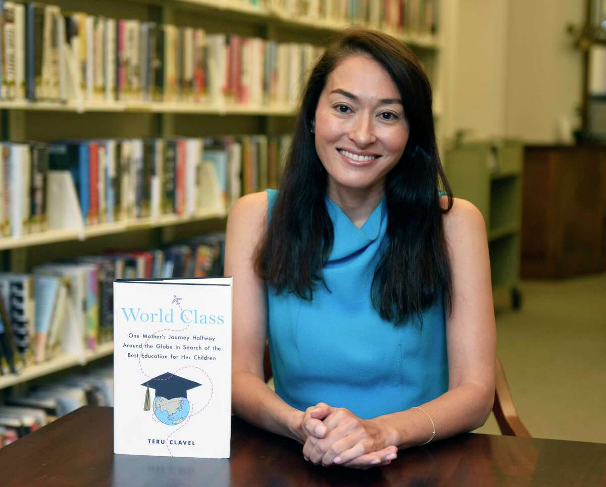 Greenwich author Teru Clavel poses with her book "World Class" at the Perrot Memorial Library in Old Greenwich in September. She will speak at the library at 7:30 p.m. Wednesday about her new book and experiences in education systems in different countries.