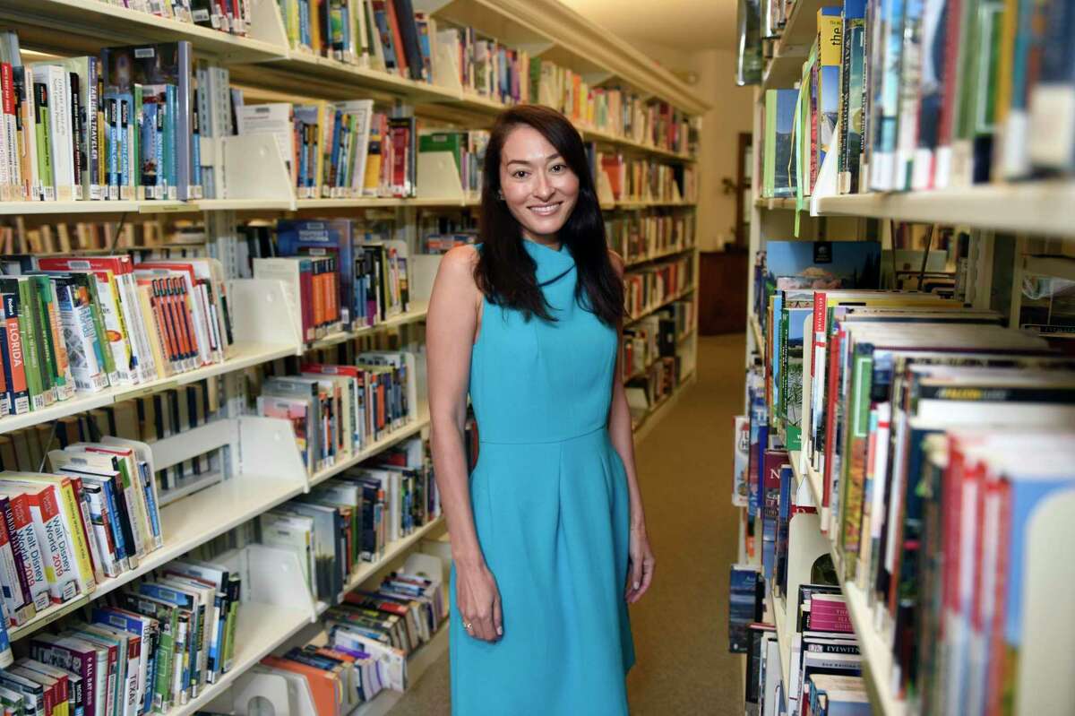 Greenwich author Teru Clavel poses at the Perrot Memorial Library in Old Greenwich, Conn. Tuesday, Sept. 10, 2019. Clavel's new book "World Class" details her experience living in three different Asian countries to give her kids the best possible education and expands on the difference between American and Asian educational systems.