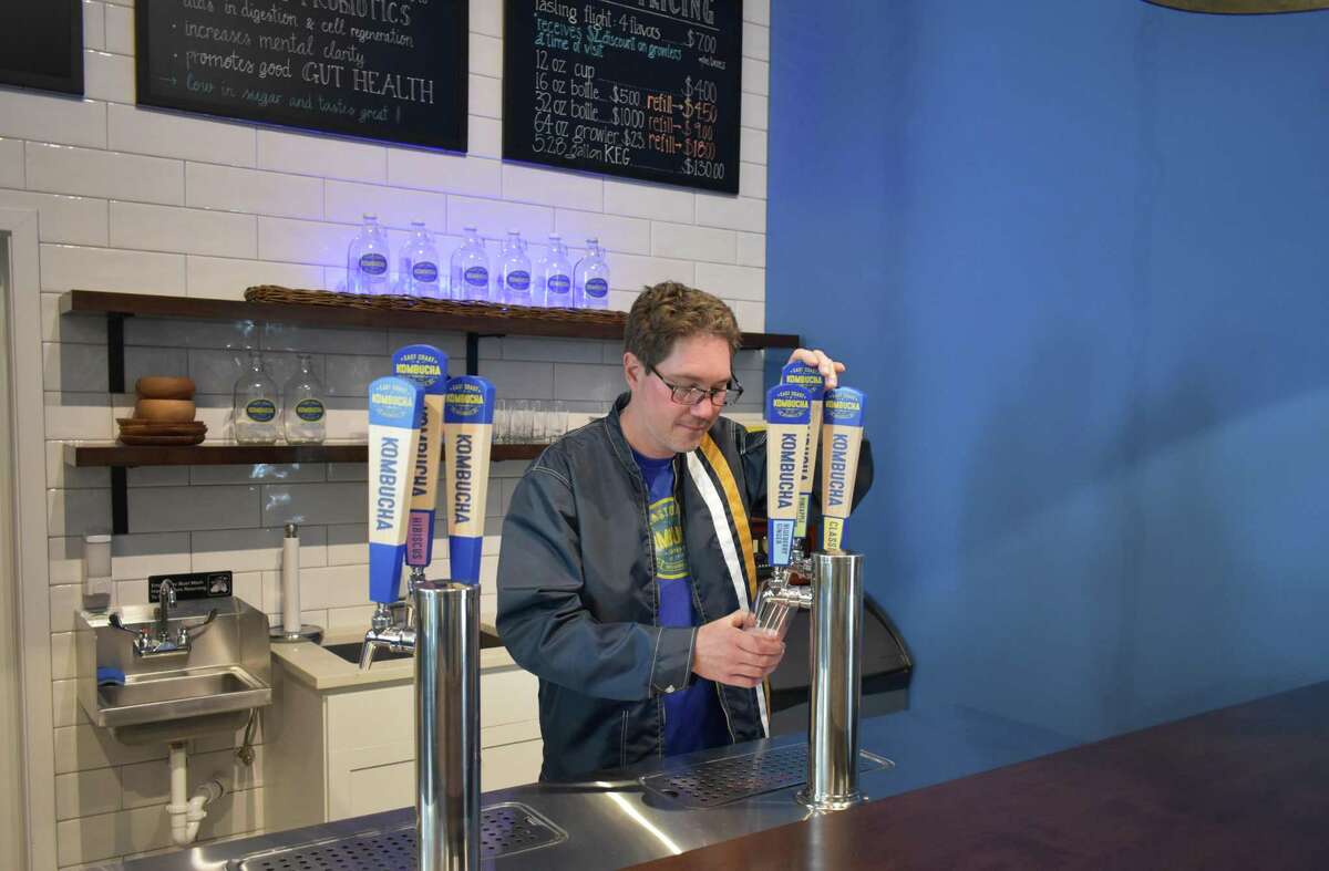 Steve Gaskin fills a glass in the taproom of East Coast Kombucha, a Norwalk, Conn. which will produce the fermented tea beverage for eateries and markets throughout the region.