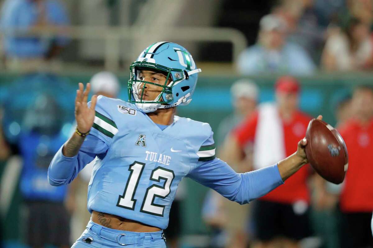 Tulane quarterback Justin McMillan throws a pass during the first half of the team's NCAA college football game against Houston in New Orleans, Thursday, Sept. 19, 2019. (AP Photo/Gerald Herbert)