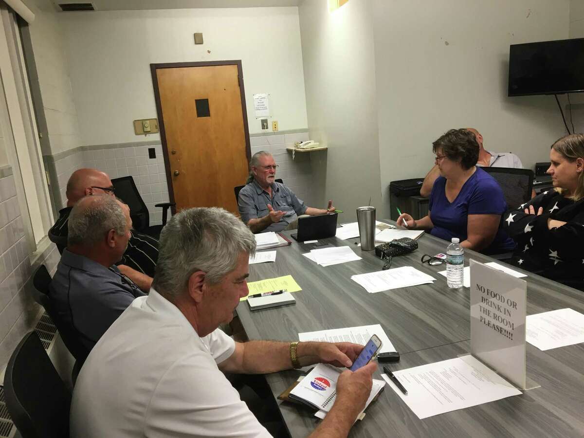 The East Haven Inland Wetlands Commission at its Sept. 11, 2019, meeting, including Chairman Gerald Jaffe, center, and Town Engineer Kevin White, at lower left.