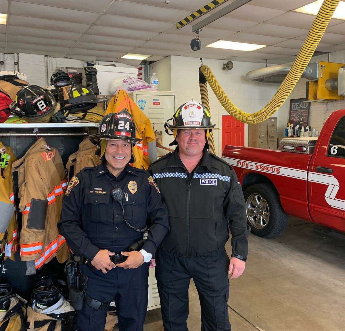 PC Steve Hutton and Ridgefield officer Jorge Romero visit the Ridgefield Fire Department.