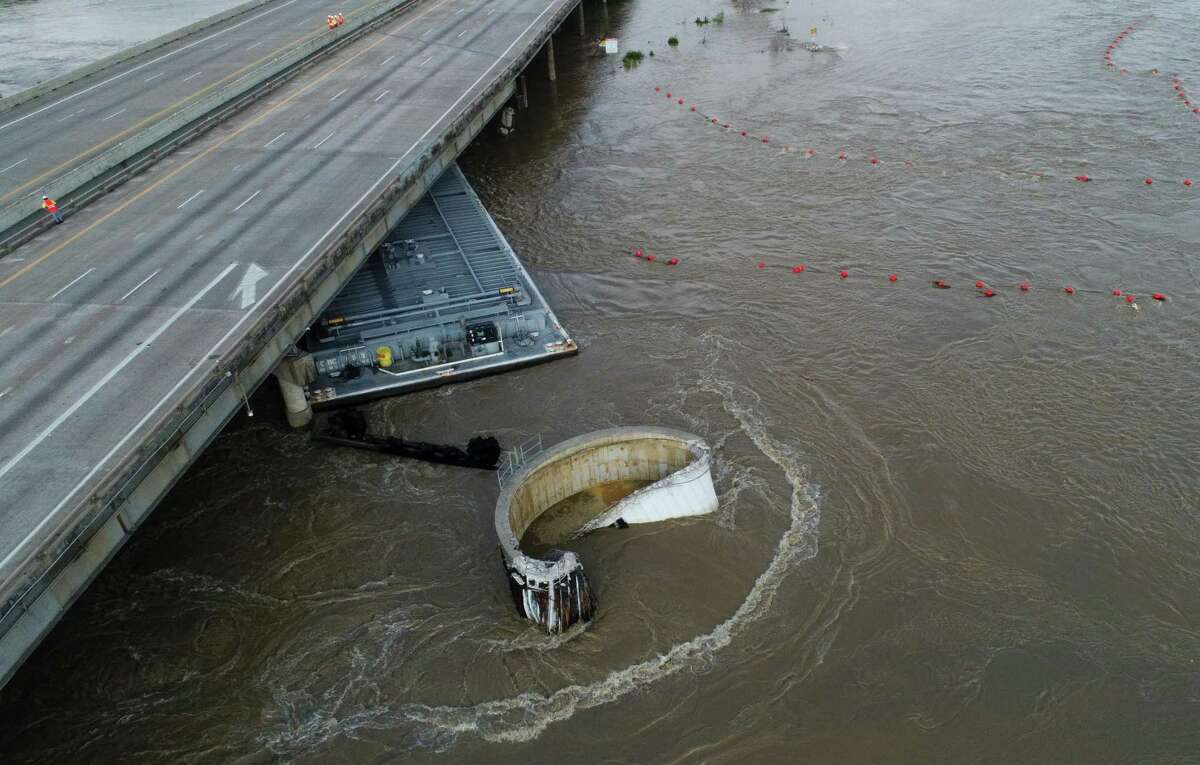 Interstate 10 at the San Jacinto River was shut down after at least two barges struck the bridge Sept. 20, as the remnants of Tropical Storm Imeldo drenched Houston and East Texas.