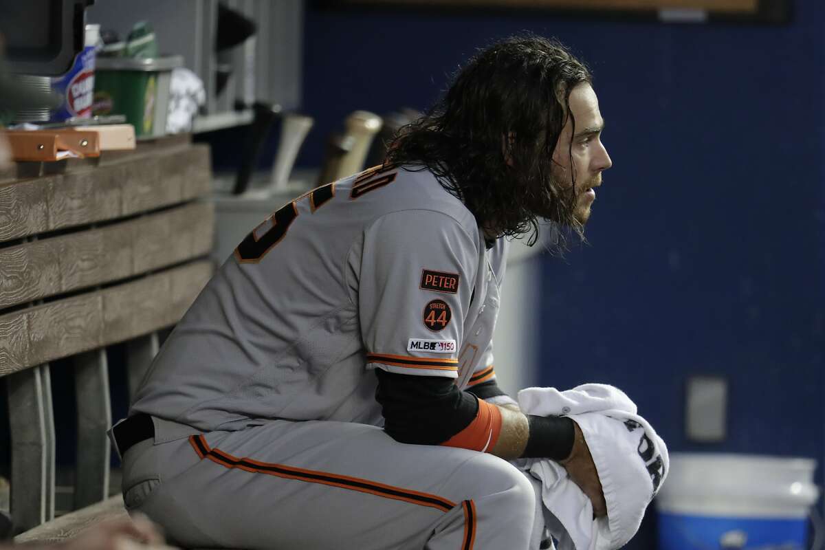 San Francisco Giants' Brandon Crawford looks from the dugout during a baseball game against the Miami Marlins, Tuesday, May 28, 2019, in Miami. (AP Photo/Lynne Sladky)