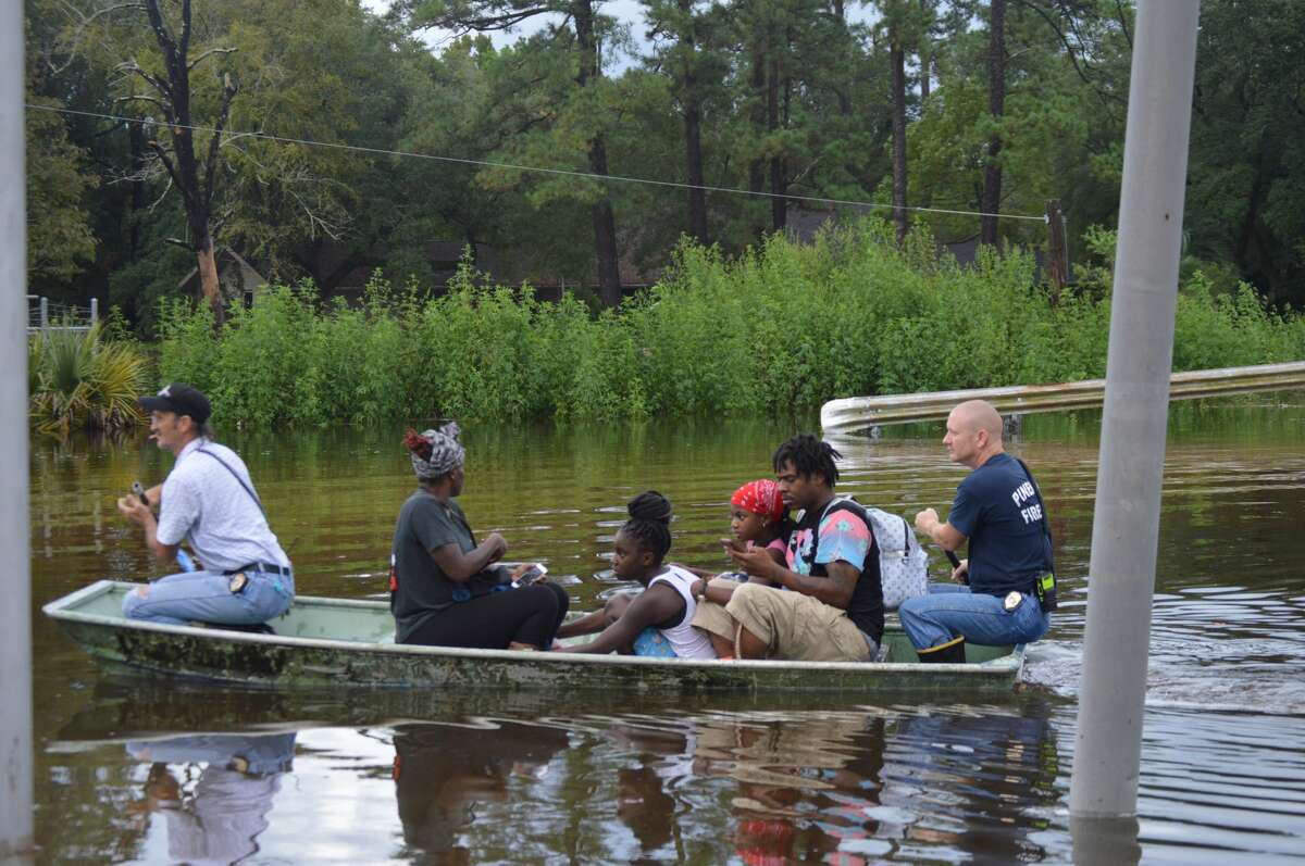Pinehurst water rescues in Camalot area Friday performed by Pinehurst Fire Department. Photos provided by Eric Williams