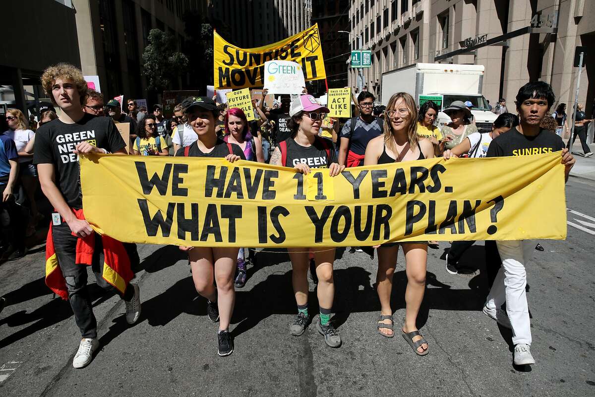 From left to right: Tucker Matta, Sukura Martin, Doe Dearr, Leah Bacon, and Stephen Pangburn, members of Sunrise Movement Bay Area, participate in the Climate Strike March in San Francisco, Calif., on Friday, September 20, 2019.