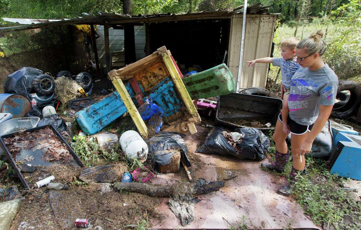 Braxton Lowen, 3, points to several of his toys he and his mother, Tiffany, discovered had floated from their home to a shed at the back of their property after it was flooded with three and a half feet of water from Tropical Depression Imelda, Friday, Sept. 20, 2019, in Splendora. “Water took my toys, Mommy,” Braxton observed.