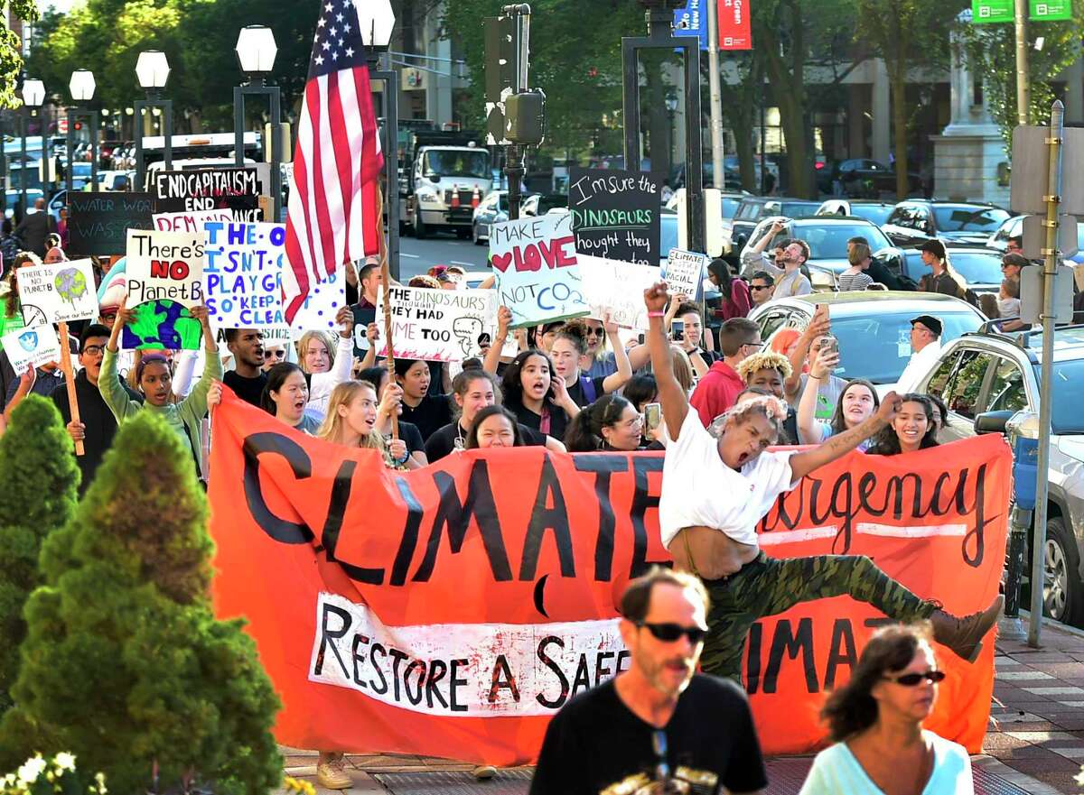 New Haven, Connecticut -Friday, September 20, 2019: The "March Against Climate Death - For A Safe Future" where approximately 750 people marched around the New Haven Green and ending at New Haven City Hall with a "die-in" as participants call for emergency action to prevent the climate death of the earth. The March and rally is led by the New Haven Climate Movement Youth that joined nationwide marches and rallies calling for emergency action on climate change.