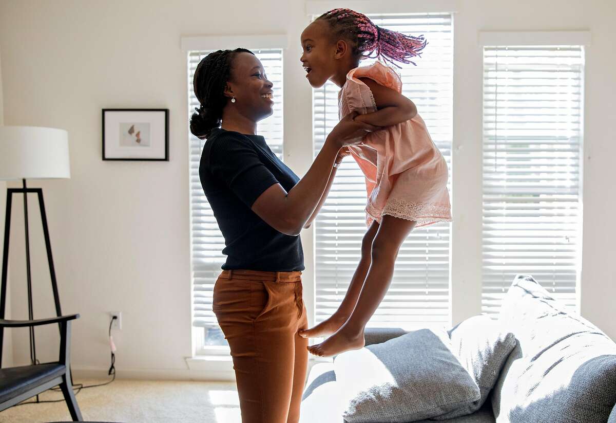 sickle0923Cassandra Trimnell, 31, laughs as her daughter Zahra, 5, jumps on the couch at their home in San Jose, Calif. Friday, September 20, 2019. Trimnell lives with sickle cell disease and founded a non-profit to promote awareness of sickle cell.
