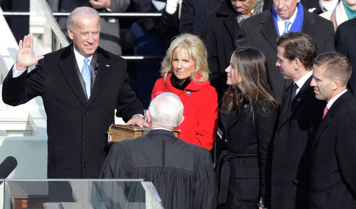 Vice President-elect Joe Biden, with his wife Jill at his side, takes the oath of office from Justice John Paul Stevens, as his wife holds the Bible at the U.S. Capitol in Washington, Tuesday, Jan. 20, 2009. At right are Biden's children Ashley, Hunter and Baeu, far right. (AP Photo/Jae C. Hong)