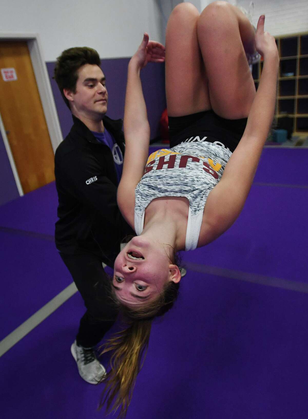Hope Wenzel, 13, of Easton, practices back flips with the help of coach Chris Polley, of Norwalk, at the Gymnastics and Cheerleading Academy of CT in the SportsPlex complex at 85 Mill Plain Road in Fairfield, Conn. on Tuesday, September 17, 2019.