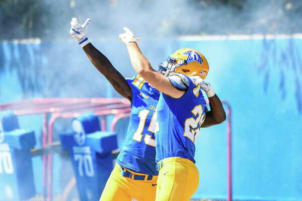 New Haven wide reciever AJ Greene (15) celebrates after a play against AIC ...