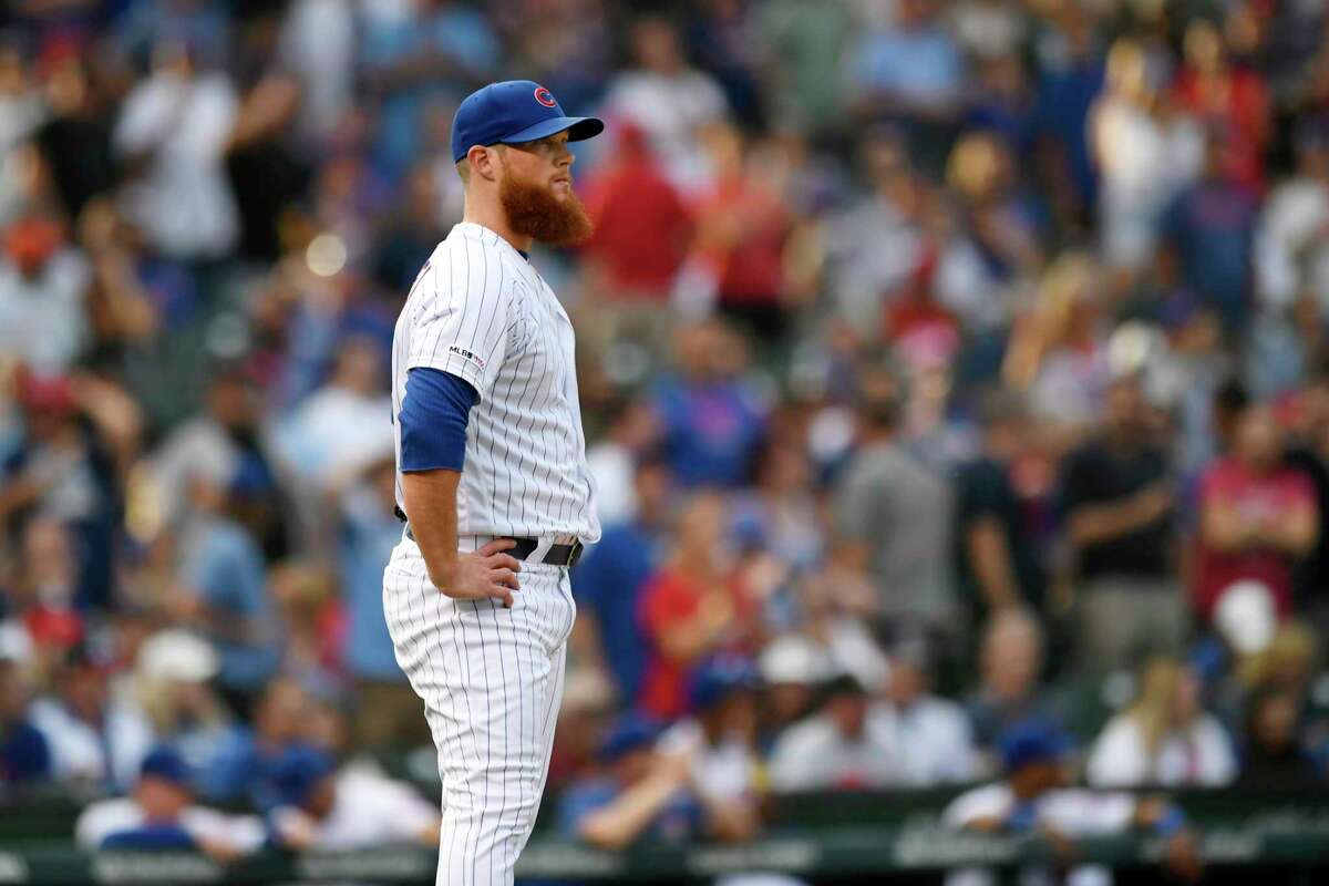 Chicago Cubs closer Craig Kimbrell reacts after giving up a solo home run to St. Louis Cardinals' Yadier Molina during the ninth inning of baseball game Saturday, Sept. 21, 2019, in Chicago. (AP Photo/Paul Beaty)