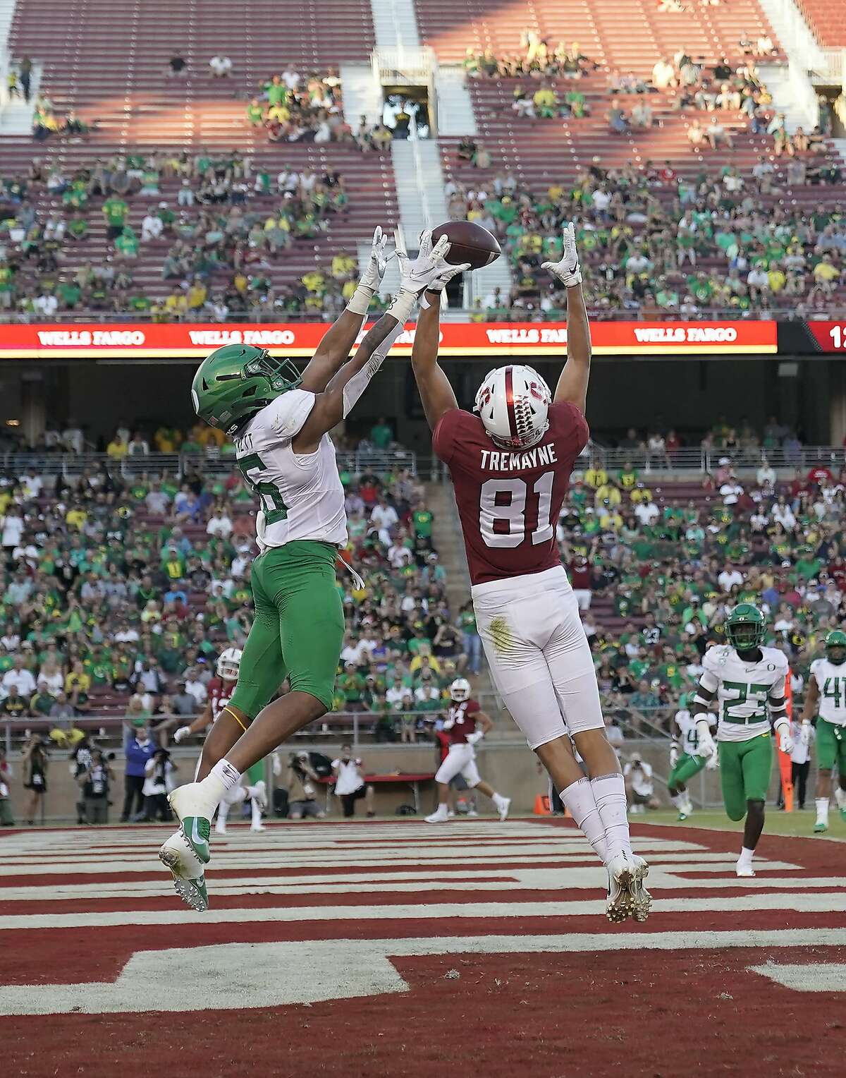 Oregon cornerback Deommodore Lenoir (6) breaks up a pass in the end zone for Stanford wide receiver Brycen Tremayne (81) during the second half of an NCAA college football game Saturday, Sept. 21, 2019, in Stanford, Calif. (AP Photo/Tony Avelar)