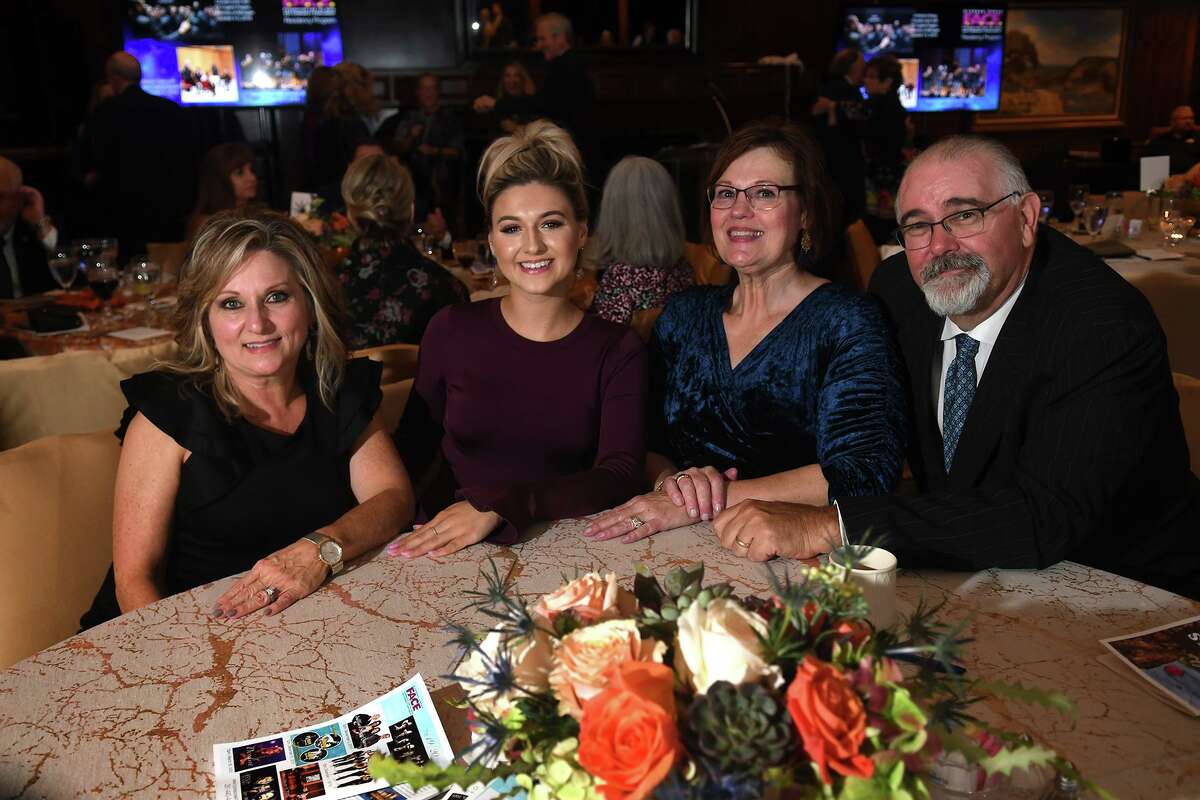 Cheryl Guenther, from left, her daughter Lauren Lothringer, Janet Cagle, and and her husband Jack share a photo during the Centrum Arts League Annual Best of the Nothwest Gala "Waltz Across Texas" at Champions Golf Club on Sept. 20, 2019.