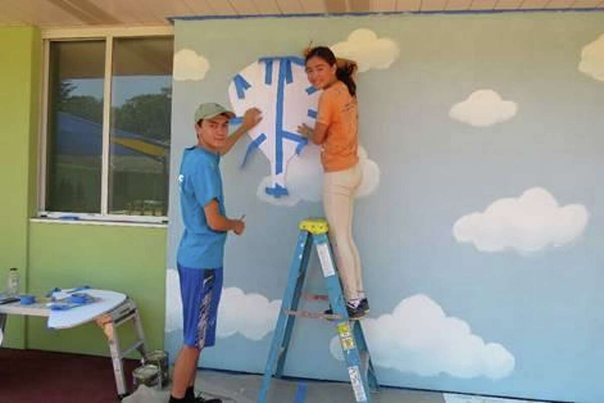 Scout Kevin O’Neill of Troop 1 Purchase, along with Claire Barry stenciling a balloon before proceeding to fill it in with paint as they created a mural for Cerebral Palsy of Westchester. O’Neill is working to earn his Eagle Scout rank.