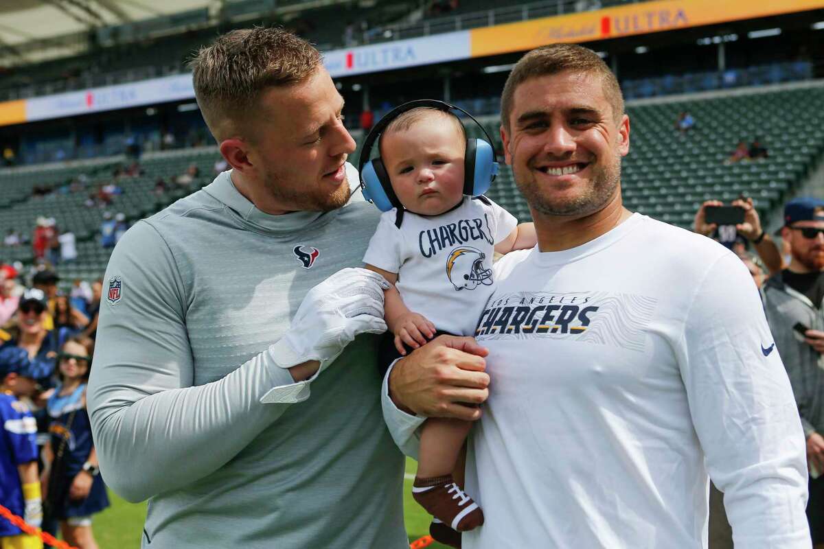 Houston Texans defensive end J.J. Watt, left, Logan Watt and Los Angeles Chargers fullback Derek Watt stand together before and NFL game at Dignity Health Sports Park on Sunday, Sept. 22, 2019, in Carson, Calif.