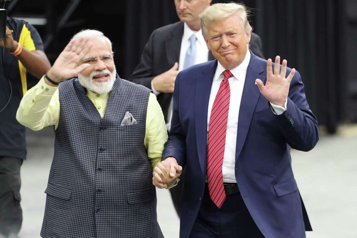 India's prime minister, Narendra Modi and President Donald Trump walk hand and hand around NRG Stadium after the Howdy Modi event Sunday, Sept. 22, 2019, in Houston.