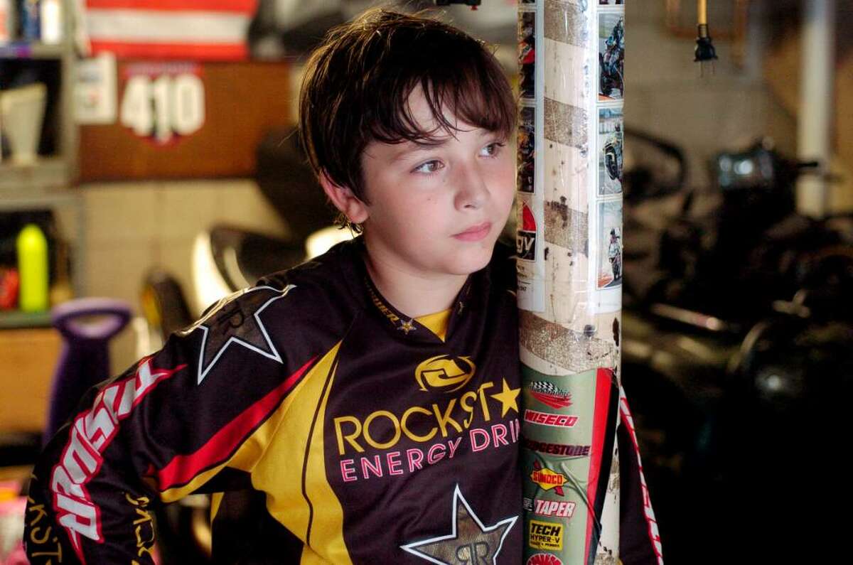Dalen Vernazza, 11, who races motorcycles in the garage of his Thornridge Road home in Stamford, Conn. on Thursday August 5, 2010.