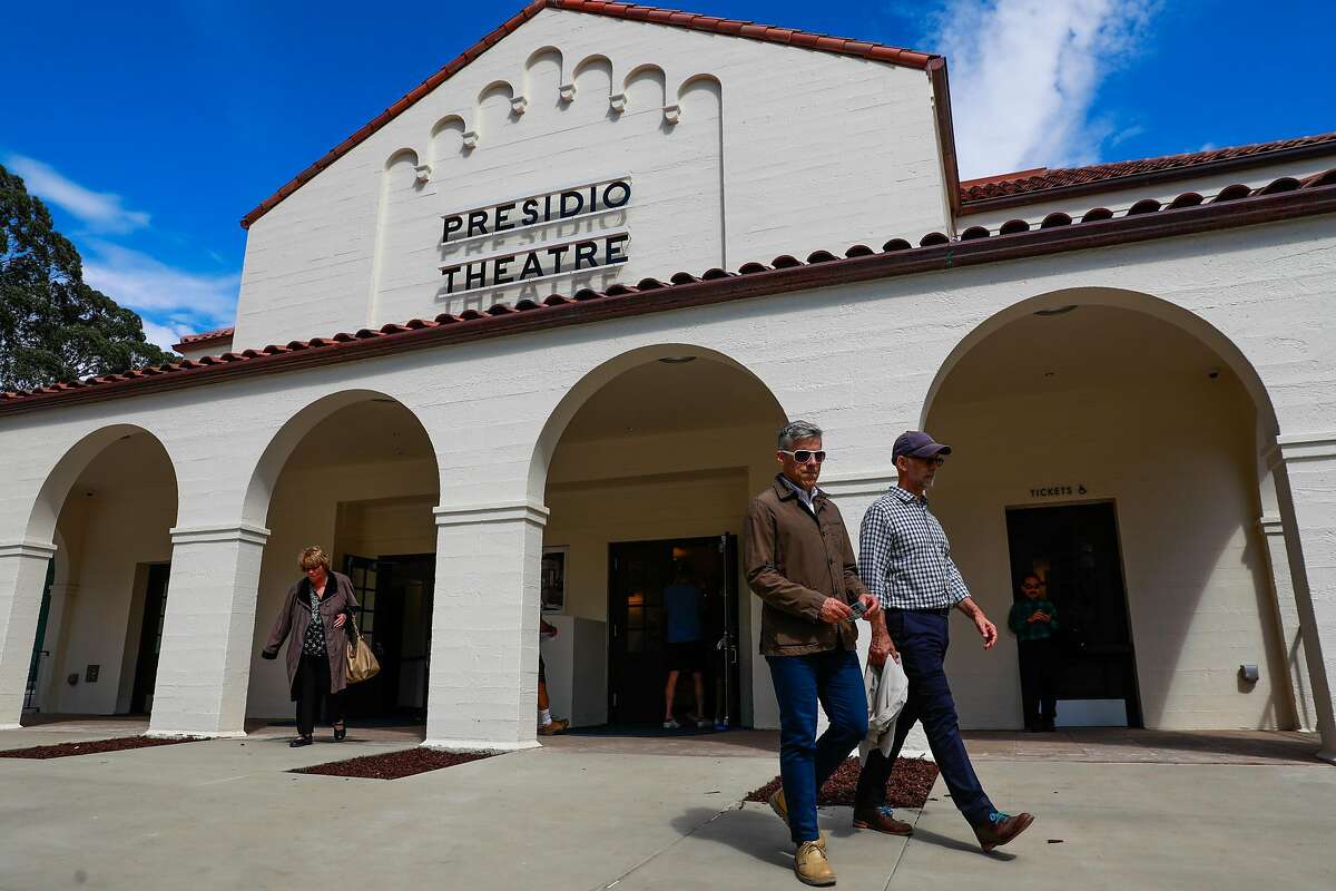 People leave the Presidio Theatre which opened for an open house for the first time in 24 years after undergoing renovations in San Francisco, California, on Sunday, Sept. 22, 2019.