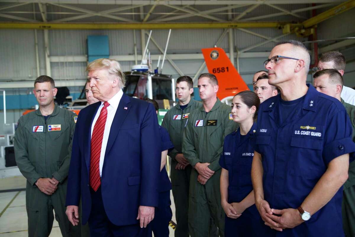 President Donald Trump answers question from the press during a stop to greet members of the Coast Guard in Ellington Field Joint Reserve Base, Sunday, Sept. 22, 2019 in Houston.