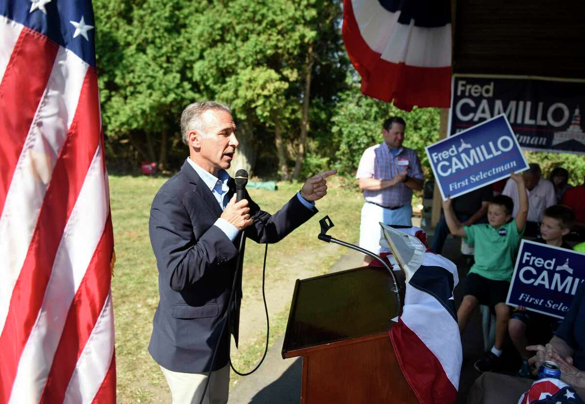 State Rep. Fred Camillo, R-Greenwich, speaks about his campaign for First Selectman at the Greenwich Republican Town Committee annual clambake at Greenwich Point Park’s Clambake Area in Old Greenwich on Sunday Local GOP elected officials and candidates gathered to drum up support for the party in preparation for the upcoming election on Nov. 5. Below, Selectman candidate Lauren Rabin speaks at the annual event.
