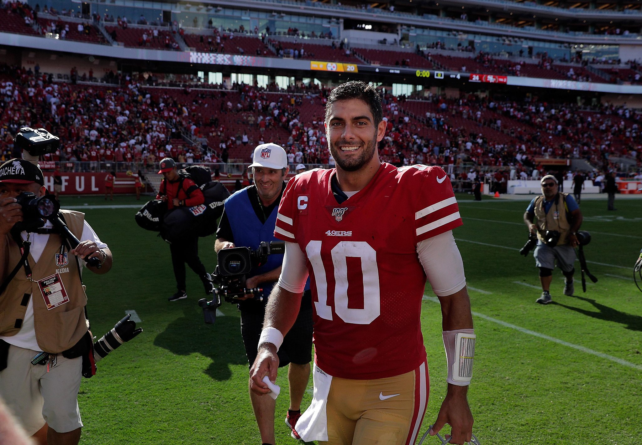 49ers' Jimmy Garoppolo leaves the field smiling again